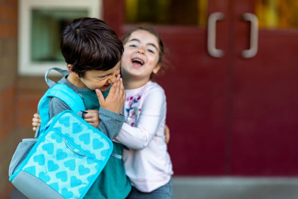 istock Young affectionate siblings play before their first day of school 1714010460