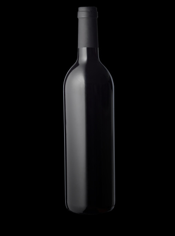 Empty glass bottle close up on a black background