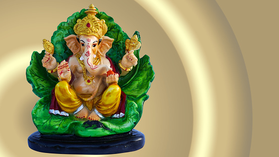Lord Ganesha on leaf, Antique lord ganesha sculpture or statue for ganesha festival.