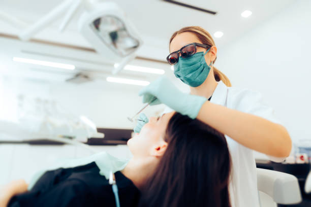 istock Dentist Wearing Glasses with magnifying lenses While Working 1714032957