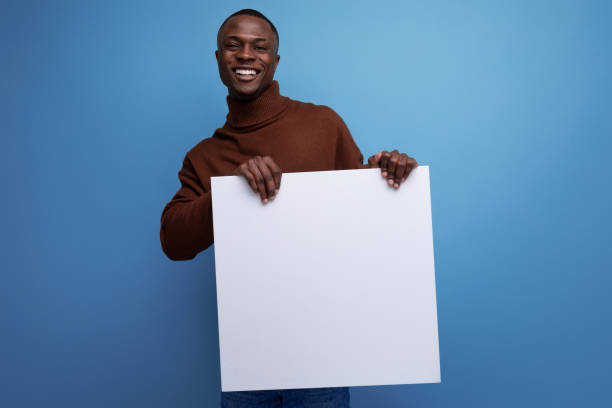 istock young african man advertise product with display on white sheet 1714034667