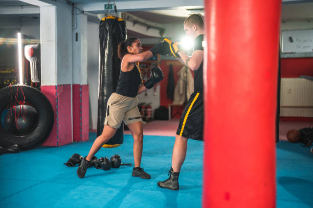 istock Latin Female Boxer Practicing In A Gym 1714038055