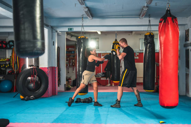 istock Hispanic Female Boxer Practicing In A Gym 1714038062