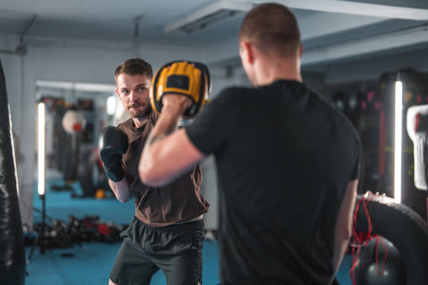 istock Caucasian Male Practicing New Boxing Sequences In A Gym 1714038067
