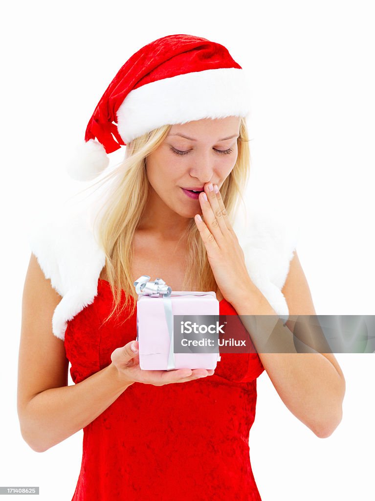 Schöne Frau gekleidet wie Santa und hält ein Geschenk - Lizenzfrei Attraktive Frau Stock-Foto