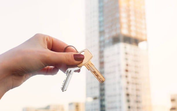 istock Real estate concept with home keys in hand 1714098650