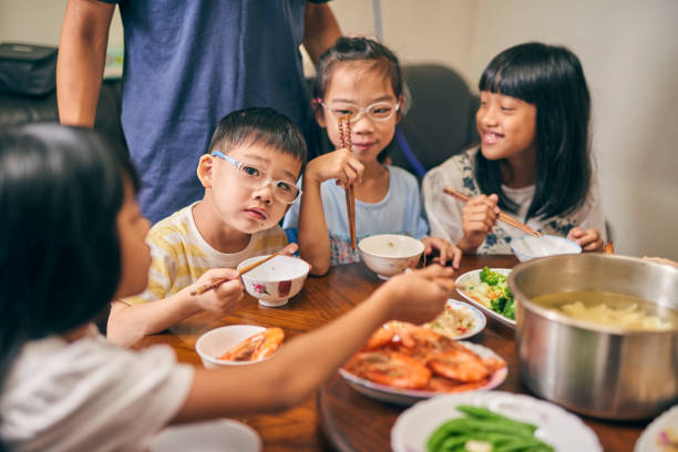istock An multi-generation Asia family eat dinner together. 1714194254