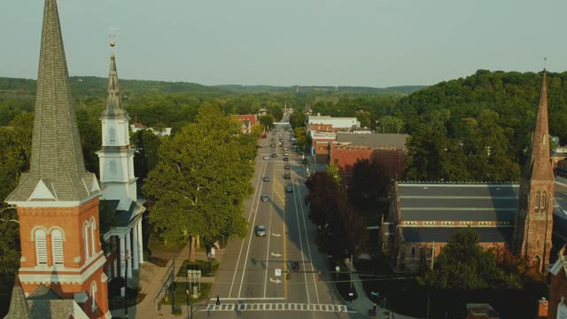 Drone shot of the churches in Downtown Palmyra New York. Also the location of the first publication of the Book of Mormon.  Early church history. 60fps