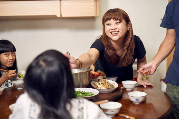 istock An multi-generation Asia family eat dinner together. 1714201402