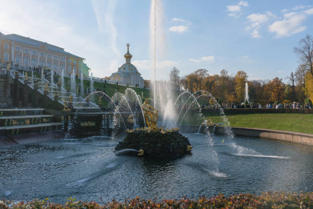 Petergof, Russia - October 2, 2021: View of the  fountain Samson at lower park of Petergof on autumn day
