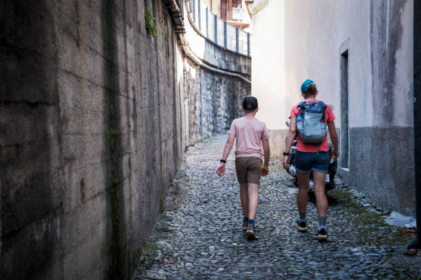 istock Mother and son exploring a small village while on vacation 1714296953