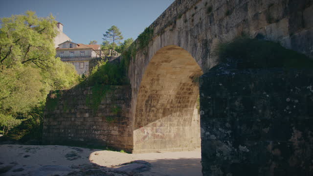 roman bridge in alcafache viseu portugal slow motion gimbal shot