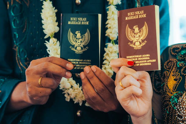 istock The marriage book is held by the bride and groom 1714369902