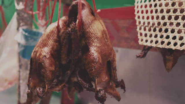 Stewed ducks hanging at market