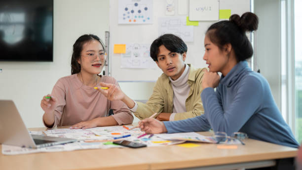 istock Professional and inspire UX UI designer team and engineer working together to get the best result. 1714383257