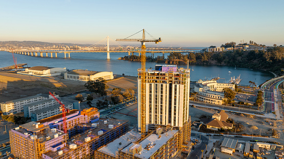 High quality aerial stock photo of large scale housing construction on Treasure Island in San Francisco, California.