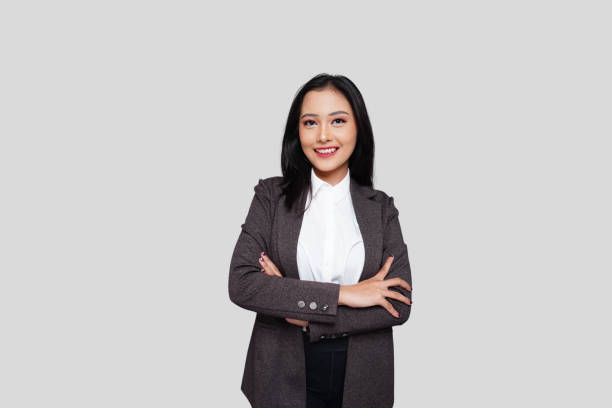 istock Young Asian Businesswoman Smiling Confidently 1714396584