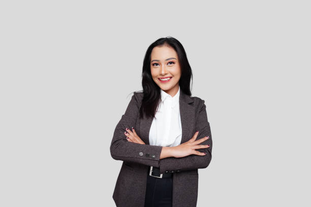 istock Young Asian Businesswoman Smiling Confidently 1714396592