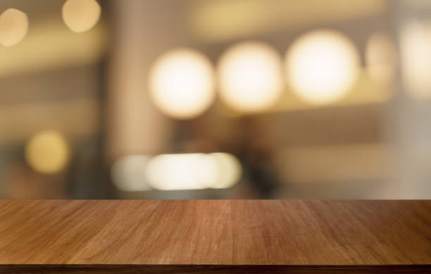 istock Mock up for space. Empty dark wooden table in front of abstract blurred bokeh background of restaurant . can be used for display or montage your product 1714396632