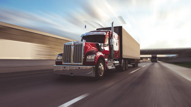 istock American style truck on freeway pulling load. Transportation theme. 3D illustration 1714411452