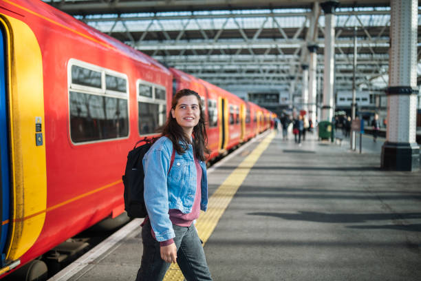 istock Young woman arrive on train station. 1714438035