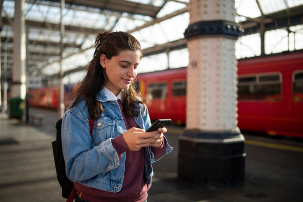 istock Waiting for the subway and using phone. 1714438042