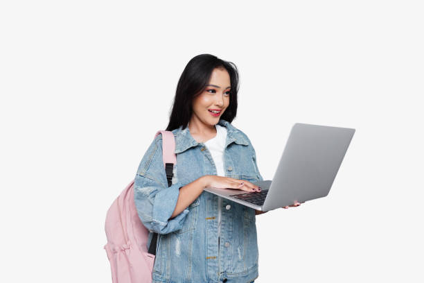 istock Young Happy Asian Female College Student with Laptop and Backpack 1714451463