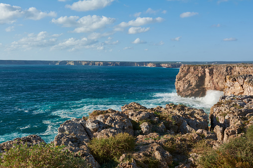 The western coastline of the Algarve. Stormy ocean with huge waves washing the cliffs in Portugal