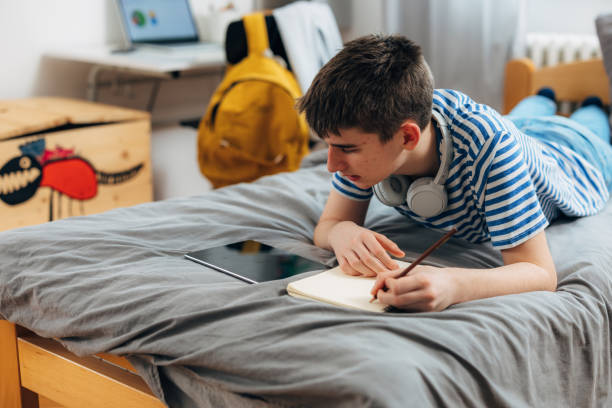 istock teenager student at home 1714468897