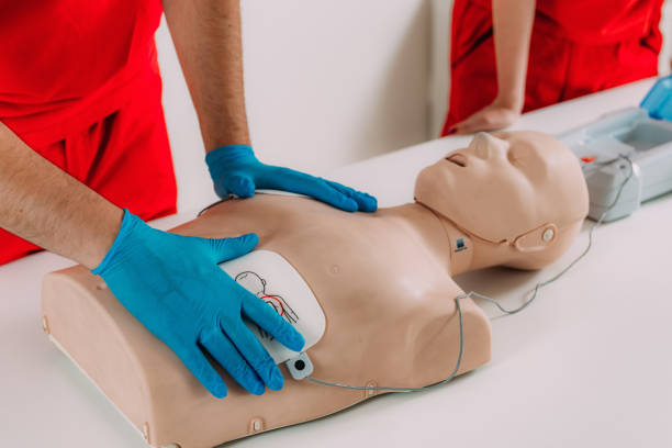istock AED first aid resuscitation course. Life saving skills in a first aid resuscitation course using an AED 1714477608