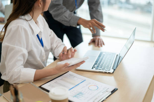 istock Professional office worker discussing and analyzing the project together in the office room. 1714479302