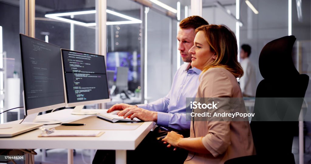 Computer Programmer Writing Program Code On Computer Stock Photo ...