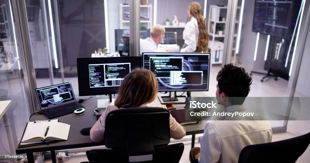 Computer Programmer Writing Program Code On Computer Stock Photo ...