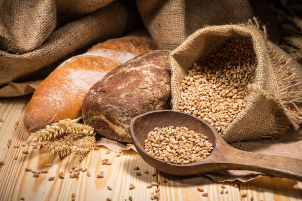 istock Assortment of baked bread on wooden table background 1714493620