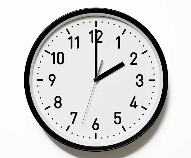 Photo of Isolated shot of 2 O'Clock clock face on white background