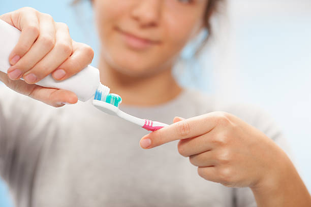 istock Young beautiful girl brushing teeth 171450467