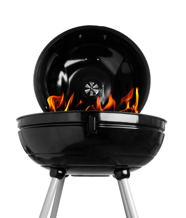 Charcoal grill with flames isolated on white.  Please see my portfolio for other grilling images.