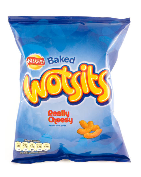 Packet of of Walkers Wotsits on a white background "St Ives, England - August 17, 2012: A bag of Walkers Wotsits on a white background. Walkers is a British snack food manufacturer owned by Frito-Lay, a subsidiary of PepsiCo." lays potato chips stock pictures, royalty-free photos & images