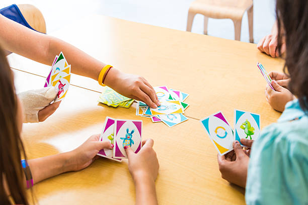istock School children playing card game 171450630