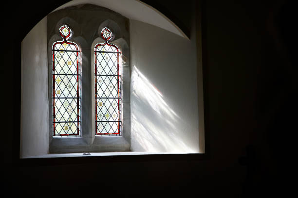 istock Light streaming into church through stained glass window 171450668