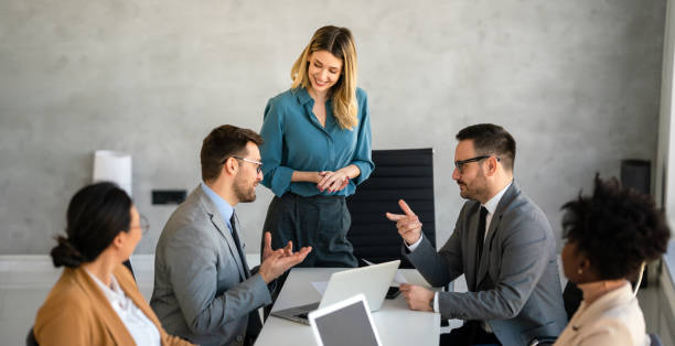 istock Multicultural professional businesspeople working together on research plan in boardroom. 1714522885
