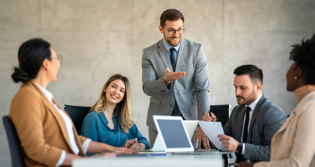 istock Multicultural professional businesspeople working together on research plan in boardroom. 1714523965