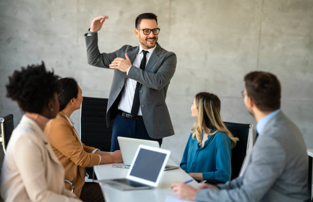 istock Multicultural professional businesspeople working together on research plan in boardroom. 1714525577