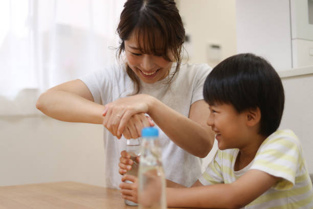 istock Parent and child drinking ramune 1714542633
