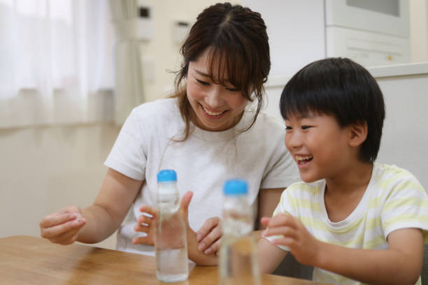 istock Parent and child drinking ramune 1714542647