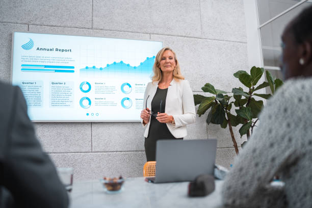 istock Mature Businesswoman's Expert Presentation in a Modern Boardroom 1714546194