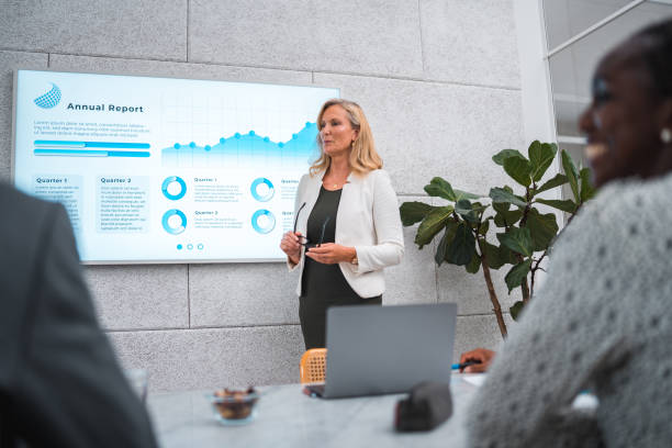 istock Mature Businesswoman's Expert Presentation in a Modern Boardroom 1714546196