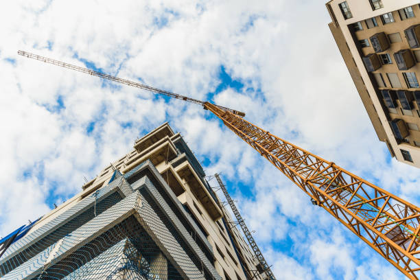 istock A large construction crane between two tall residential buildings. 1714558195