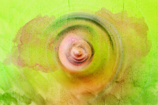 Abstract background with concentric circles flowing from the center in yellow tones and rough texture.