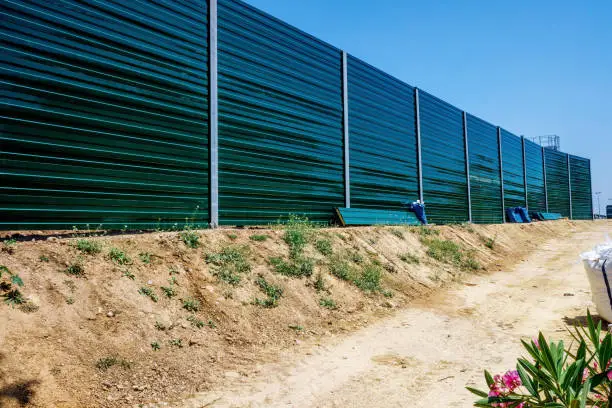 Construction of a high border wall to prevent illegal immigration.